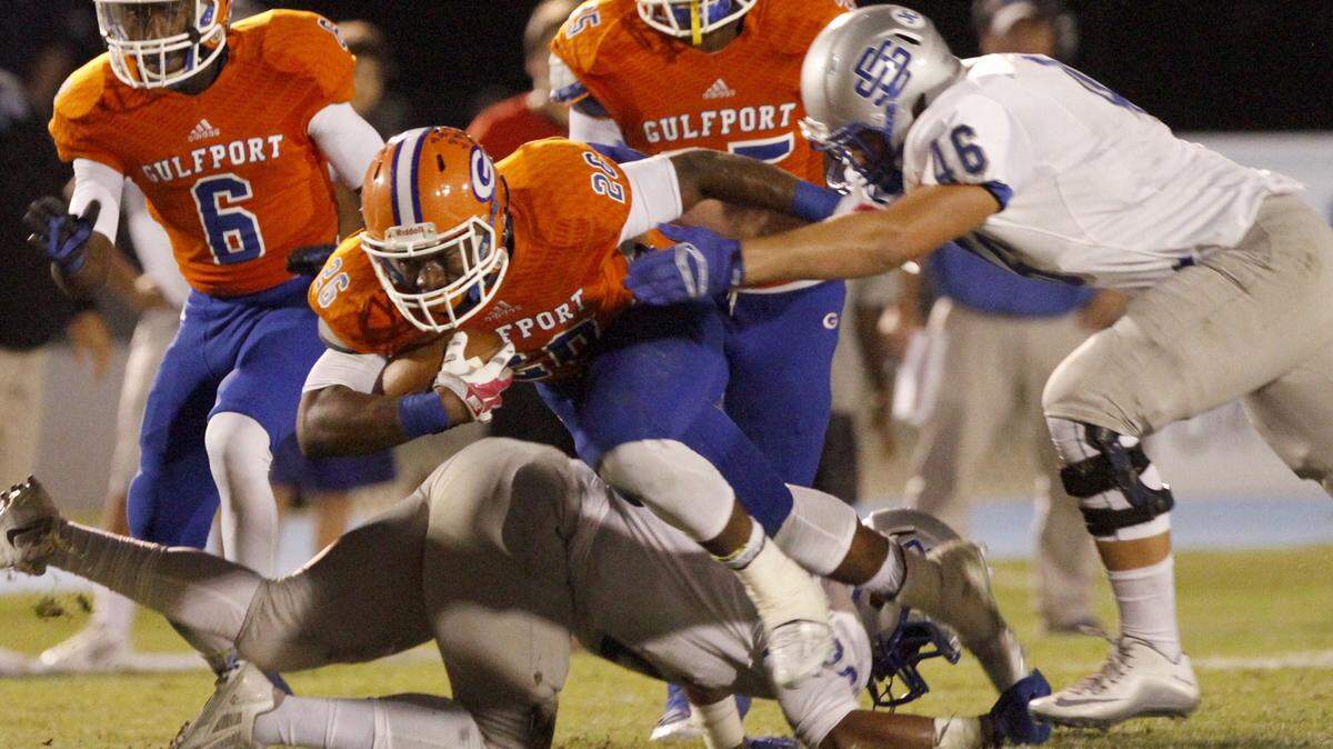 TIM ISBELL/SUN HERALD 
 Gulfport running back Deon Cole (26) and the Admirals jumped up to No. 7 in the final Associated Press prep poll.
