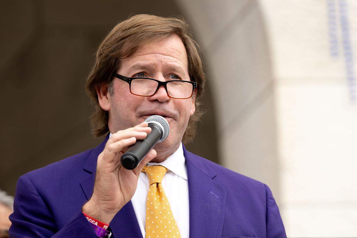 Mark Mavar gives an introductory speech to the crowd during the Gulf Coast Carnival Association’s Fat Tuesday parade in Biloxi on Tuesday, Feb. 17, 2026.