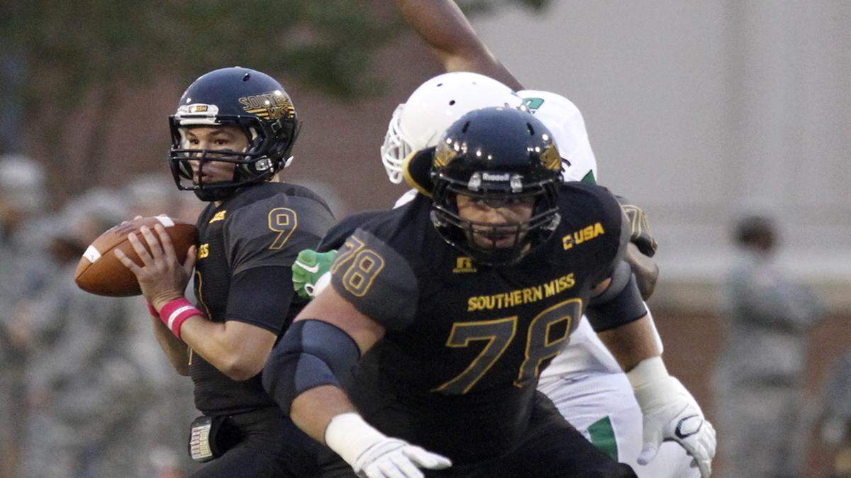 TIM ISBELL/SUN HERALD 
 Southern Miss quarterback Nick Mullens looks downfield for a receiver Saturday in Hattiesburg. USM travels to Marshall Friday.