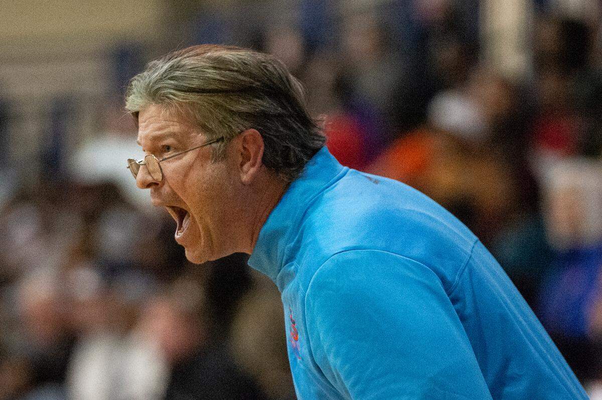 Gulfport Mens Basketball Head Coach Owen Miller yells from the sidelines during a game against Biloxi at Gulfport High School in Gulfport on Friday, Jan. 13, 2023.