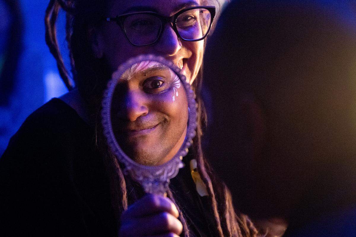 Traci Domingo shows Deanen Lacy his face after it is painted during Night to Shine at Woolmarket Baptist Church on Friday, Feb. 13, 2026.