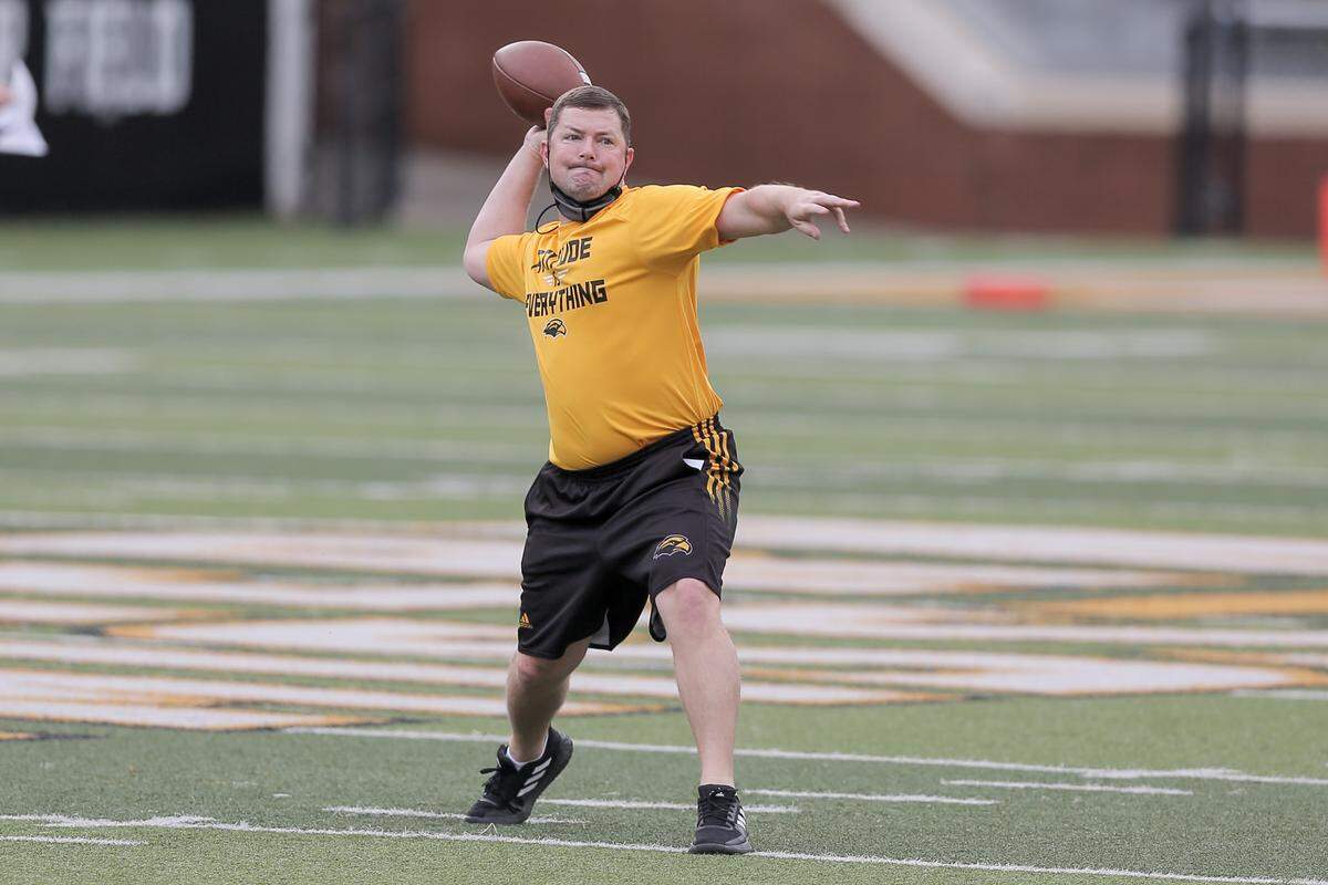 Head coach Will Hall throws the ball at Southern Miss’s Saturday practice February 27, 2021 at M.M. Roberts Stadium in Hattiesburg.