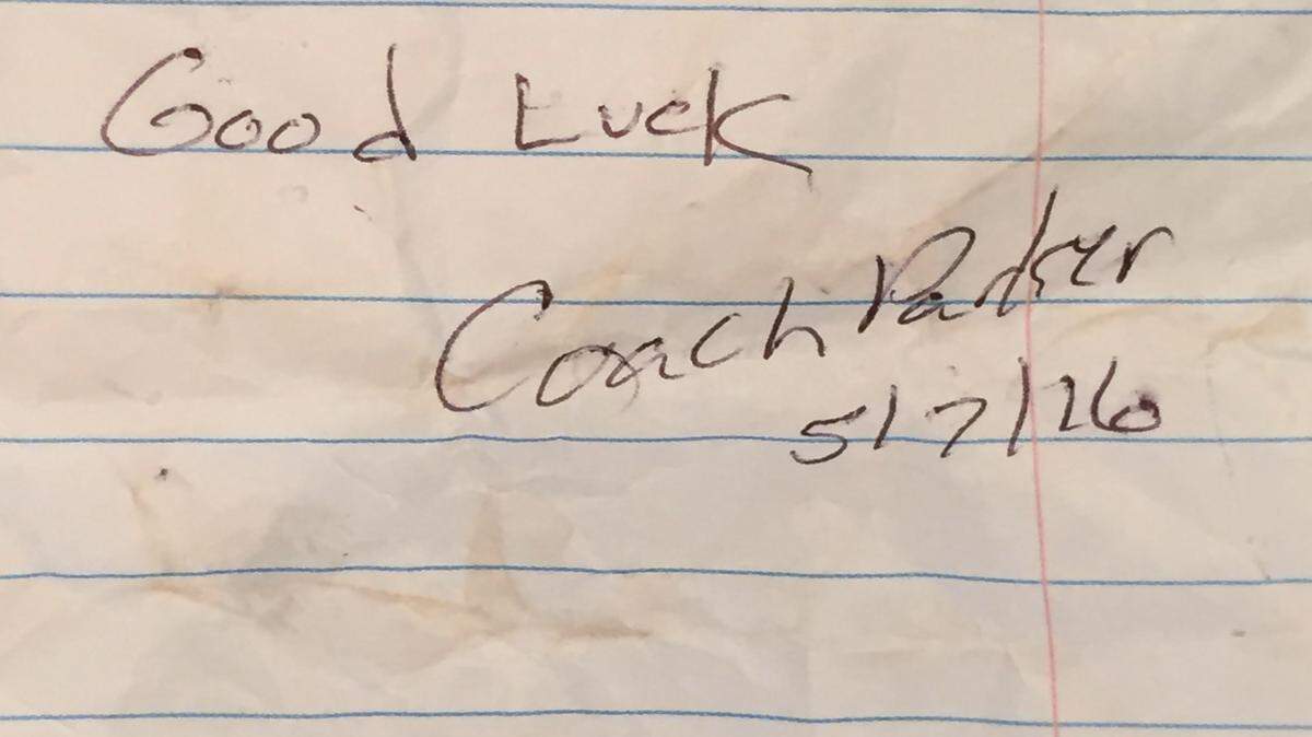 COURTESY KATELYN GRUICH 
 Harrison Central coach Jimmy Parker gave St. Martin's Katelyn Gruich a note after his Red Rebelettes eliminated the Lady Yellow Jackets from the playoffs. Parker later said it was the first time in his coaching career his has given an opponent a note.