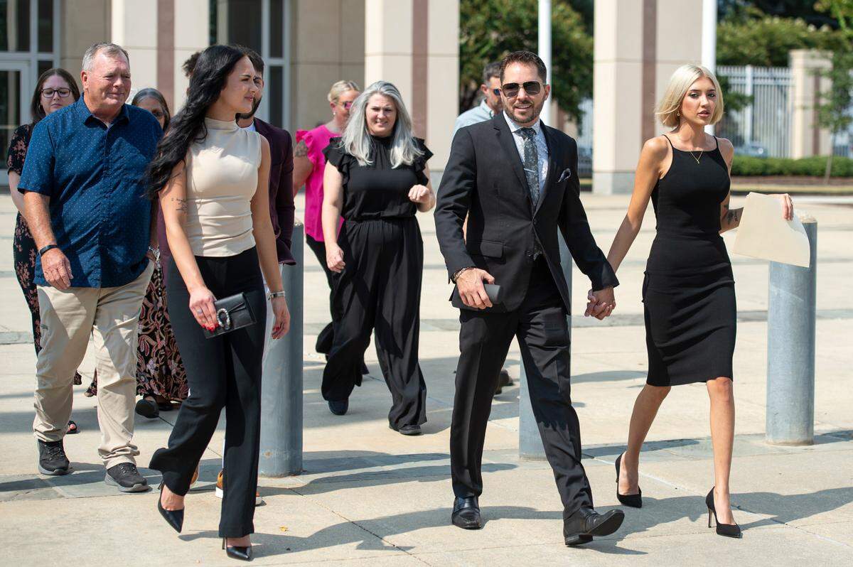 Former Biloxi city councilman Robert Deming III and his partner leave Dan M. Russell Federal Courthouse in Gulfport on Tuesday, Aug. 13, 2024, after Deming’s sentencing in a federal drug case.