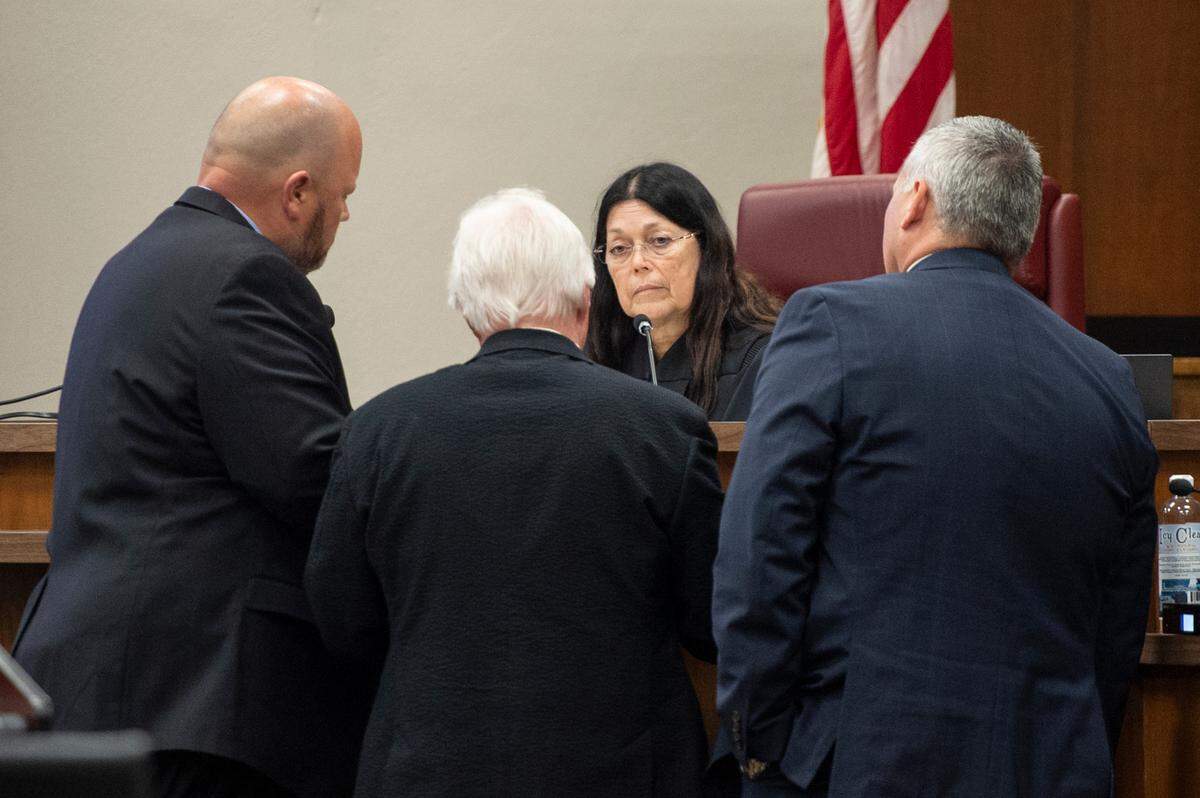 Prosecution and defense attorneys meet with Judge Lisa Dodson during day one of the trial of Johnny Max Mount for the 2015 murder of Julie Brightwell in Harrison County Court in Biloxi on Tuesday, June 13, 2023.
