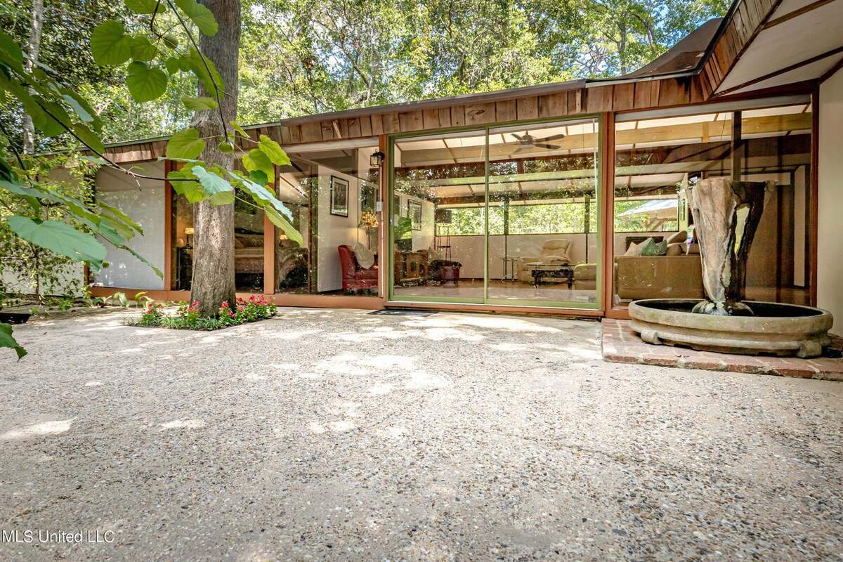 This house designed and built by Carroll Ishee, who was self taught, is for sale on Nelson Road in Ocean Springs. The unique home includes three bedrooms and two baths for $459,000. Windows across the back of the house allow light to pour into the open living area.