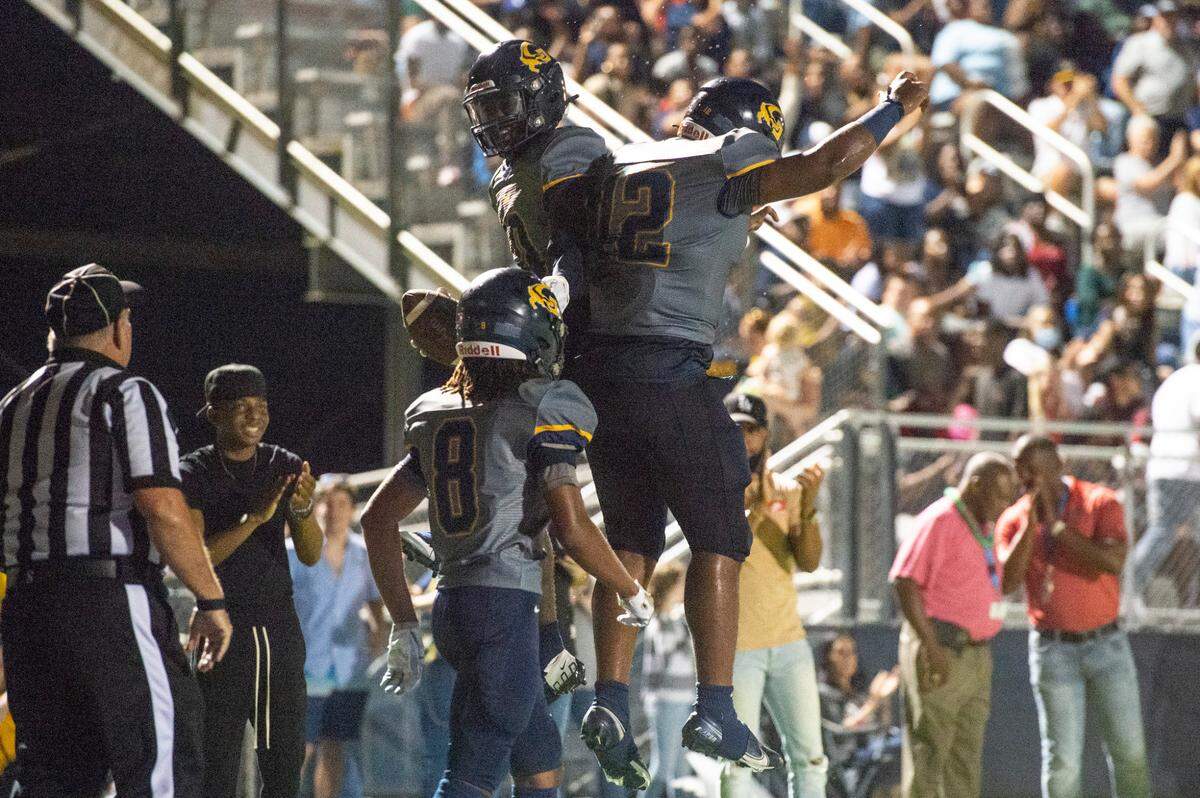 Gautier’s Kaden Irving and AJ Philips celebrate after scoring a touchdown against Pascagoula at Gautier High School on Friday, Sept. 2, 2022.