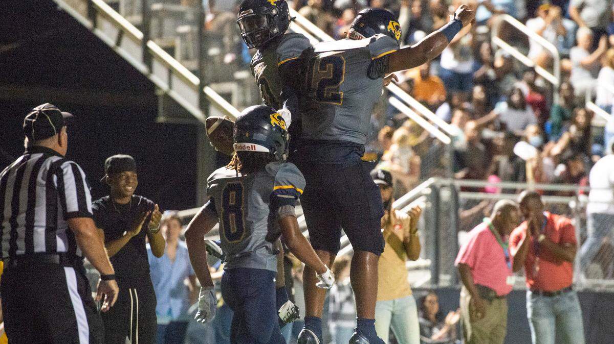 Gautier’s Kaden Irving and AJ Philips celebrate after scoring a touchdown against Pascagoula at Gautier High School on Friday, Sept. 2, 2022.