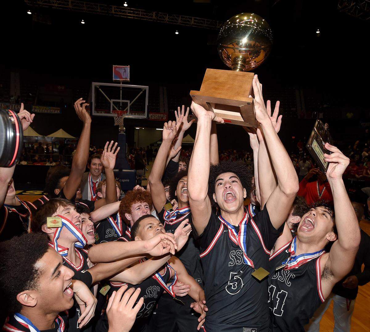 The St. Stanislaus Catholic Rock-A-Chaws celebrate winning the MHSAA Class 3A Basketball state championship.