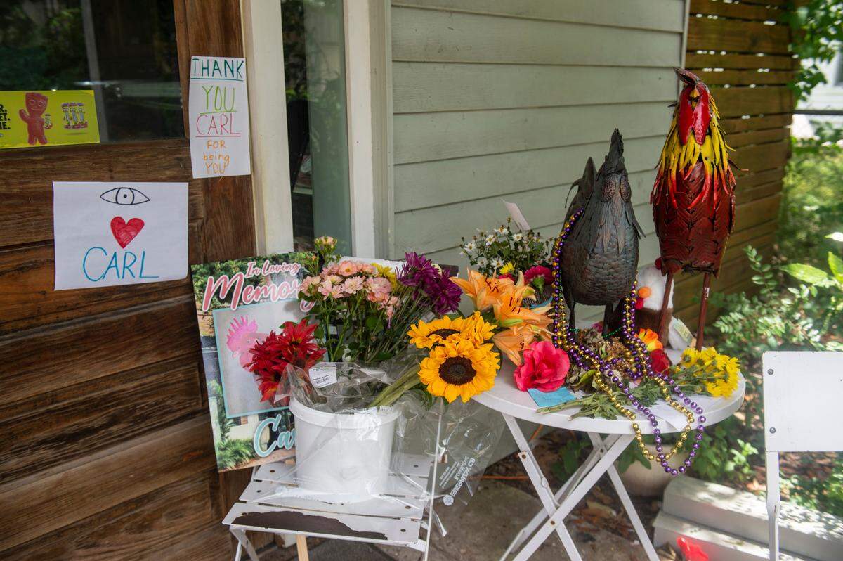A memorial to honor Carl the rooster sits outside of Lil’ Market in Ocean Springs on Monday, May 2, 2022. Carl, a local celebrity and community pet, was abducted and killed last week.