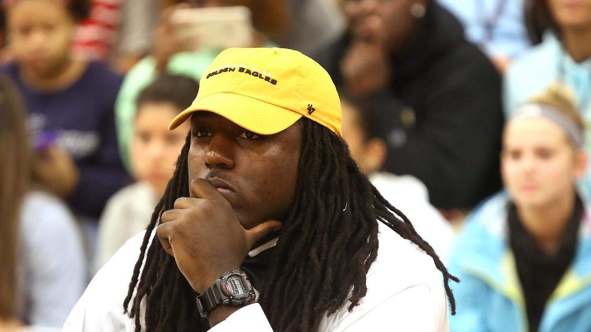 AMANDA McCOY/SUN HERALD 
 D'Iberville senior Jacques Turner attends a Signing Day ceremony at D'Iberville High on Wednesday, February 3, 2016. Turner signed a National Letter of Intent to University of Southern Miss.