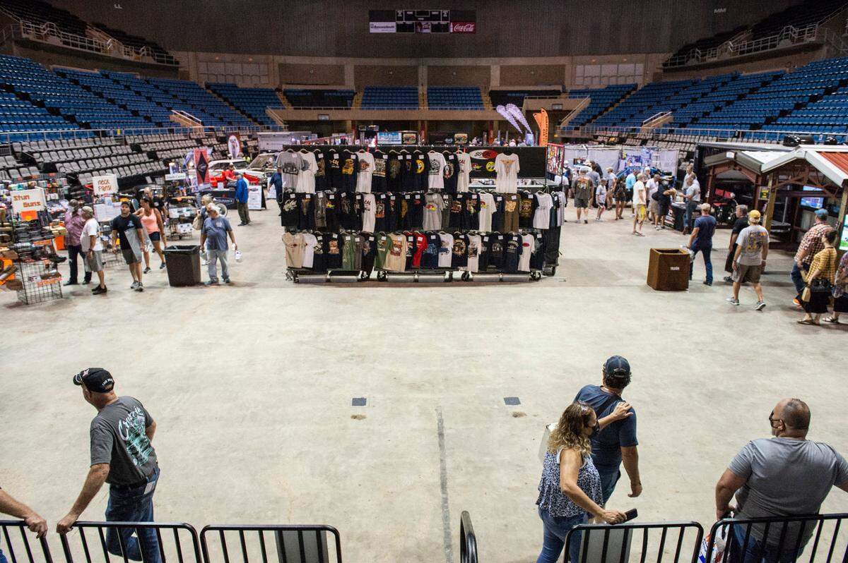 Visitors walk through the Cruisin’ The Coast swap meet at the Mississippi Coast Coliseum and Convention Center on Thursday, Oct. 7, 2021.