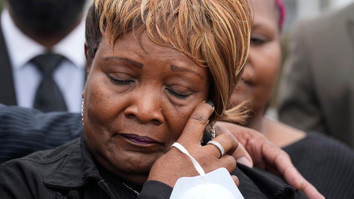Bettersten Wade, mother of Dexter Wade, a 37-year-old man who died after being hit by a Jackson, Miss., police SUV driven by an off-duty officer, wipes away tears as she watches her son’s body transferred to a mortuary transport, after being exhumed from a pauper’s cemetery near the Hinds County Penal Farm in Raymond, Monday, Nov. 13, 2023. Civil rights attorney Ben Crump said Monday he is asking the U.S. Justice Department to investigate why authorities waited several months to notify the family of his death. (AP Photo/Rogelio V. Solis)
