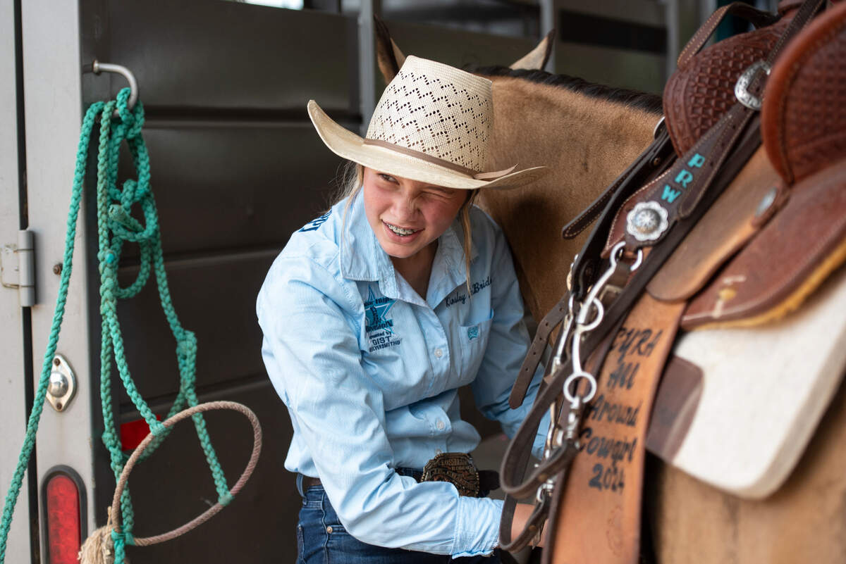 Kinsley McBride prepares her horse Houdini for practice at the Harrison County Fairgrounds on Thursday, June 13, 2024.