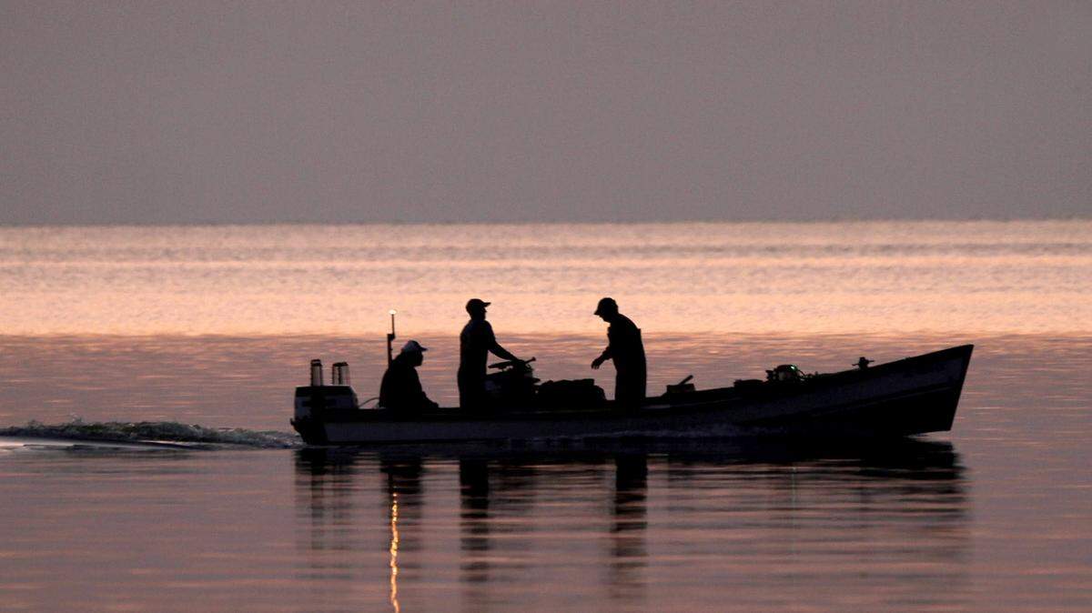 TIM ISBELL/SUN HERALD 
 Before the sun rises, fishermen leave Pass Christian harbor as they head to oyster reefs. Harvesting of Coast oysters have suffered from Hurricane Katrina, BP oil spill and 2011 Bonnet Carre release of flood water.