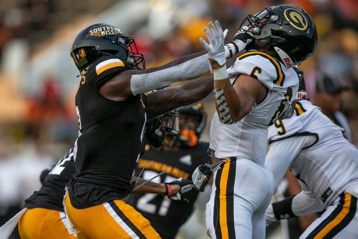 Southern Miss’s Malik Shorts grabs Grambling State’s CJ Russell on Saturday, Sept. 11, 2021.