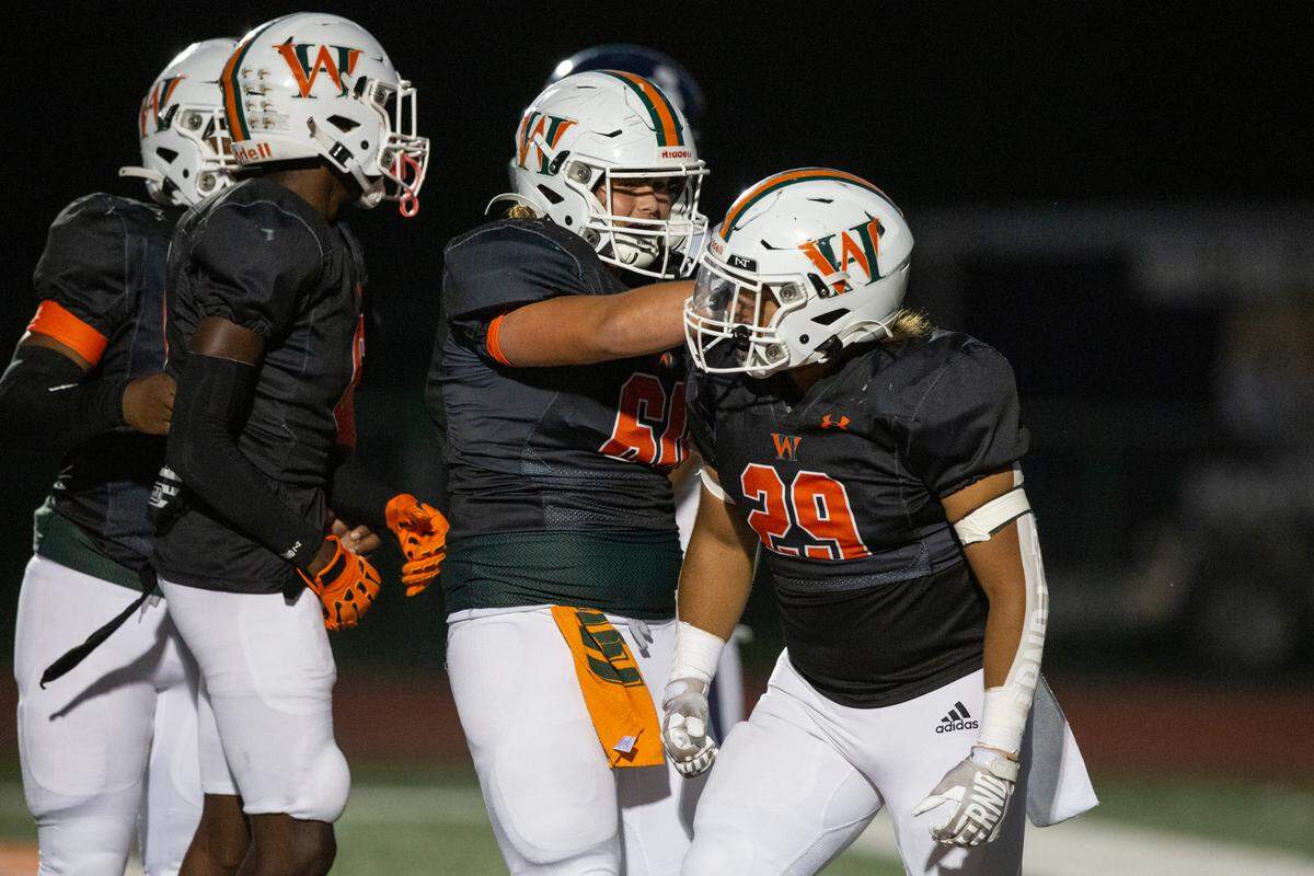 West Harrison Hurricanes’ Jeremy Jones celebrates with his teammates after scoring during a game against Moss Point at West Harrison High School in Gulfport on Friday, Sept. 22, 2023.