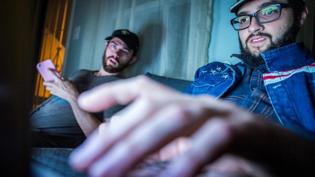 Liberty Writers News founders Paris Wade, left, and Ben Goldman work at their apartment in Long Beach, California on November 14, 2016.