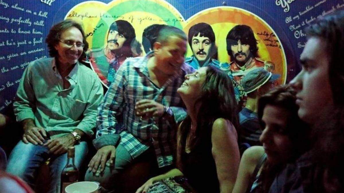 Cubans enjoy a night out March 20 in Havana in a Beatles-themed club called  Submarino Amarillo, which translates to Yellow Submarine. 