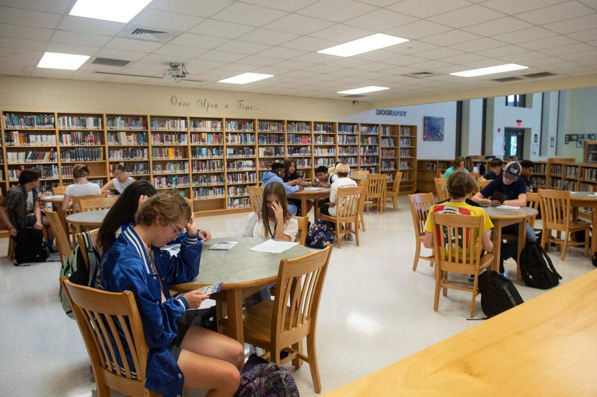 High school students wait for the first day of school to start at Ocean Springs High School in Ocean Springs on Friday, Aug. 5, 2022.
