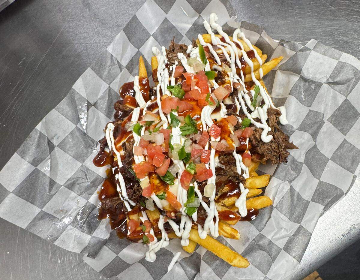 Luckies Diner’s loaded fries come topped with brisket from The Shed Barbecue and Blues Joint.