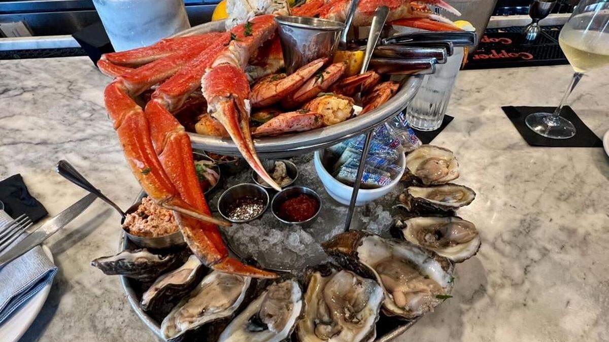 A seafood tower has a mix of royal red shrimp, snow crab, oysters and seafood salads at the Thorny Oyster in downtown Bay St. Louis.
