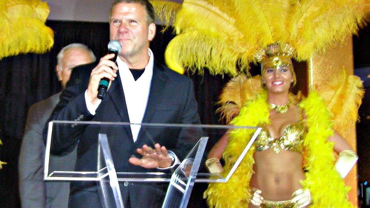 MARY PEREZ/SUN HERALD 
 Tilman Fertitta, president of Landry's, speaks to the crowd that gathered Friday for the ribbon cutting and re-branding of the Golden Nugget Casino Biloxi. The billionaire who has it all now has his own reality TV show on CNBC, where he'll have the opportunity to help small business owners succeed.