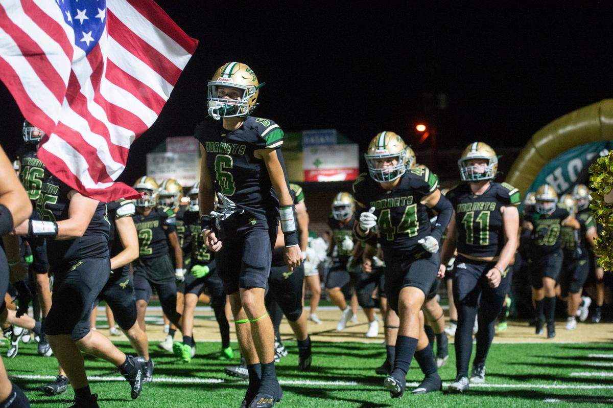 Poplarville runs onto the field before a playoff game between Poplarville and Mendenhall at Poplarville on Friday, Nov. 8, 2024.