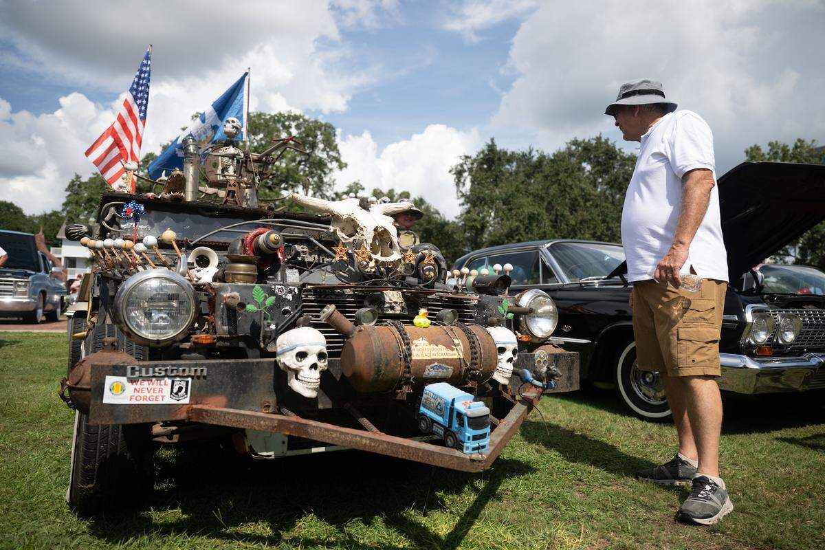 Event attendees check out cars Wednesday at the Biloxi Block Party.
