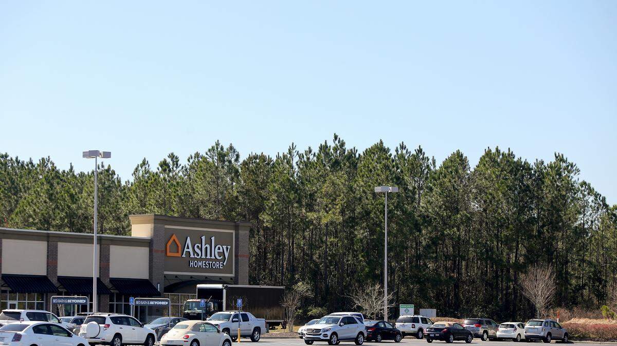 AMANDA McCOY/SUN HERALDNew development soon will be coming to a wooded area west of The Promenade in D'Iberville. ETC Ventures of Nashville, Tenn., is asking the city to subdivide 4 acres south and 17 acres north of Promenade Parkway for additional shops, restaurants and possibly hotels. Mugshots is the first restaurant that will be built.