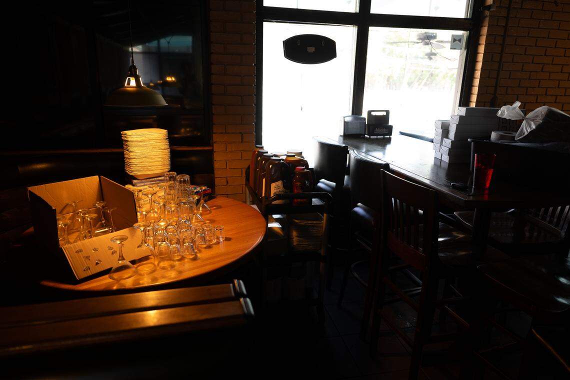 Glass cups are packed away at Castaways in Ocean Springs on Monday, April 27, 2026.