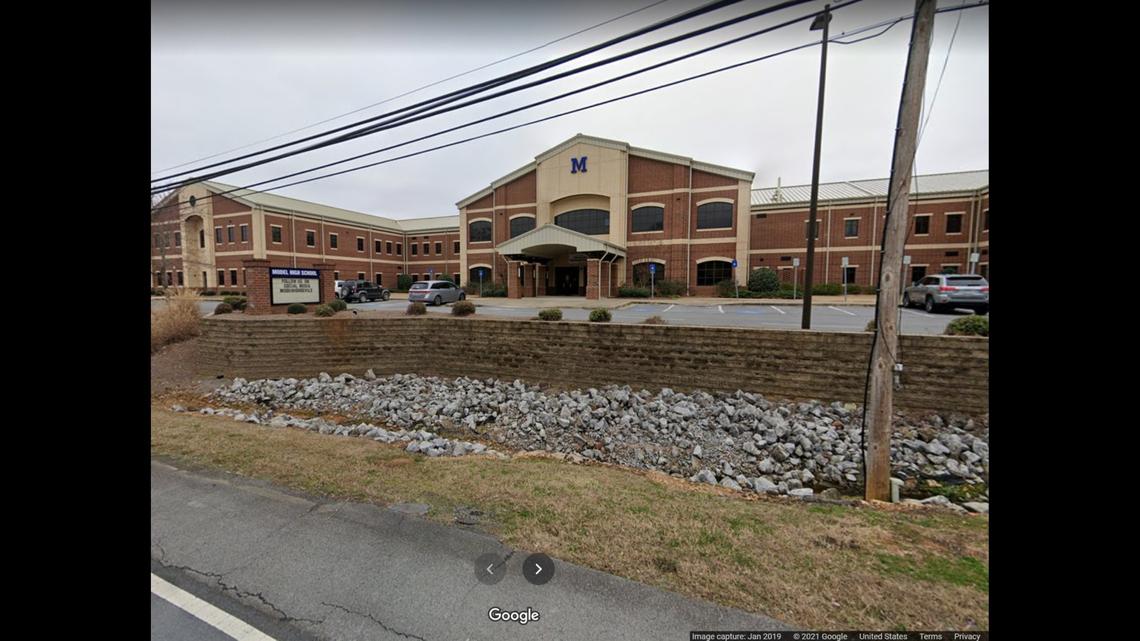 A Georgia student was arrested on weapons charges after allegedly bringing a loaded pistol and hunting knife to Model High School in Rome, police say.