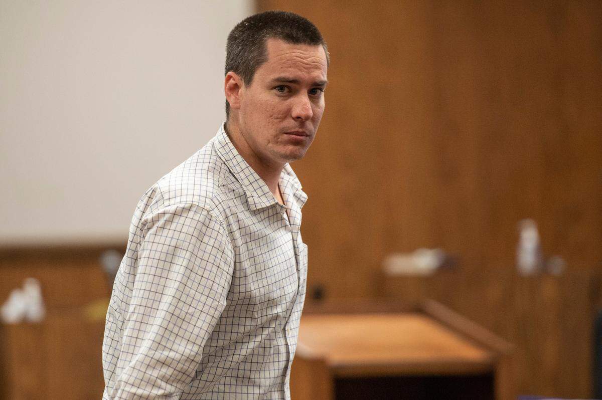 Byron Ellison, who is accused of killing his two-month old son, leaves the courtroom during a break during his murder trial in Gulfport on Tuesday, March 29, 2022.