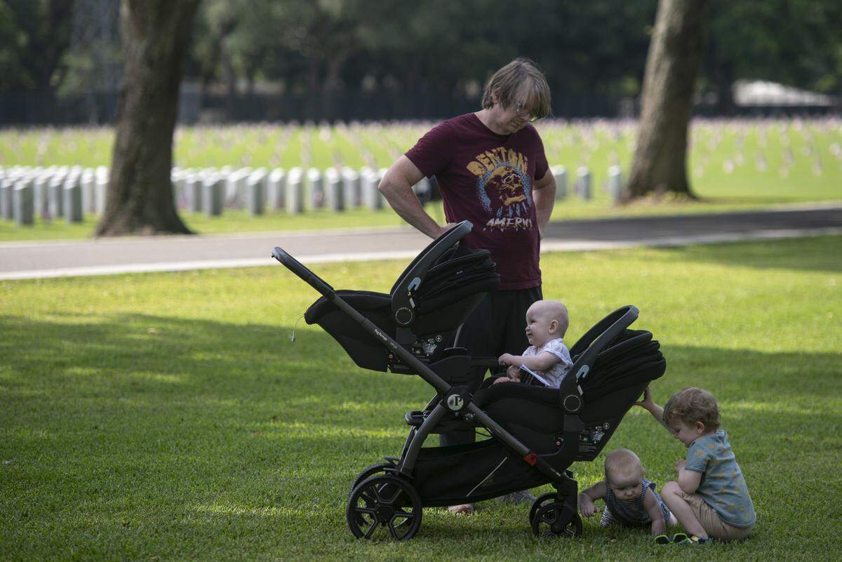 Families attend a Memorial Day ceremony at Biloxi National Cemetery in Biloxi on Monday, May 26, 2025.