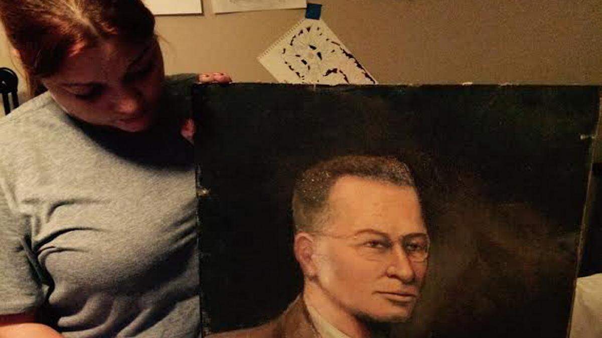 COURTESY BARBIE WILCOXBarbie Wilcox diplays the painting she and her boyfriend found discarded in Biloxi.