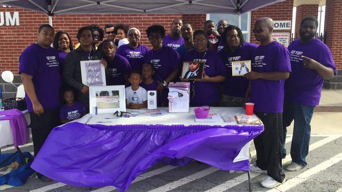 JEFF CLARK/SUN HERALD 
 The family of the late Gulfport rapper Lance 'Supa Villain' Carter remembers the musician during an epilepsy walk Saturdy at Harrison Central High School. Carter died from an epileptic seizure at age 28 in 2014.