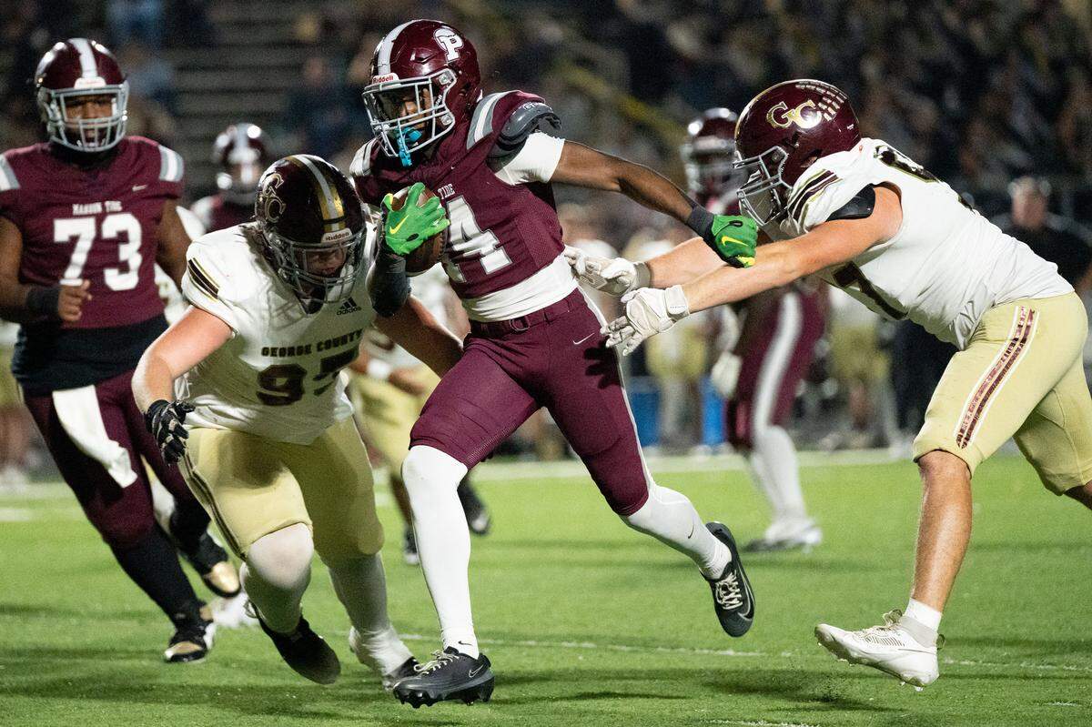 Picayune running back Jordan Hathorne (14) picks up yards Friday in the Tide’s rout of George County.