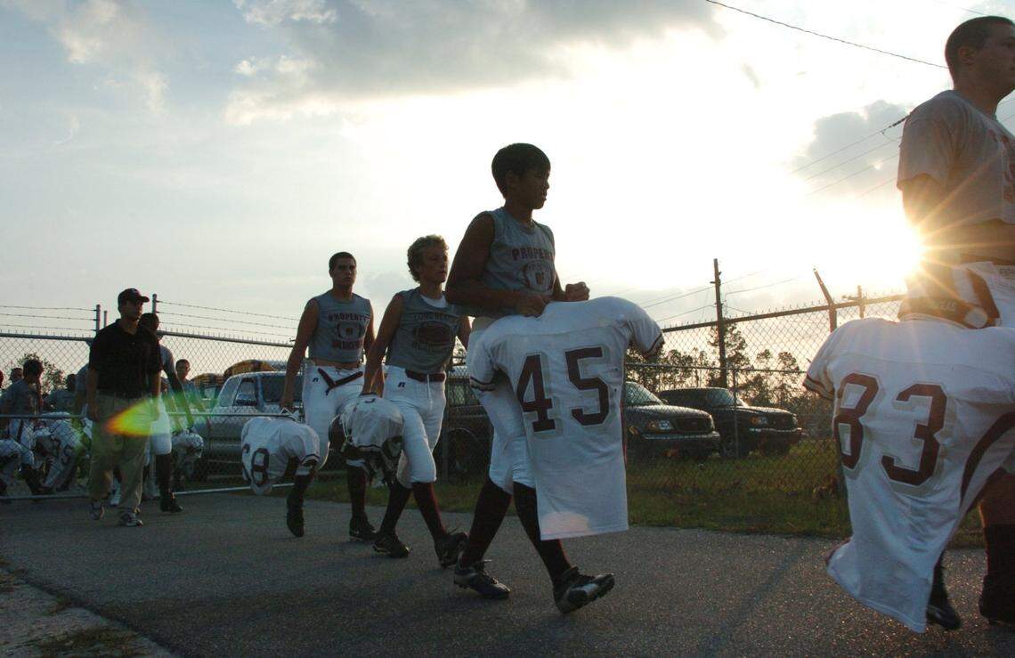 The Long Beach High School football team arrives at McCullough stadium in 2005 for a game against Bay St. Louis after a bus ride that took twice as long as it would have before Hurricane Katrina.
