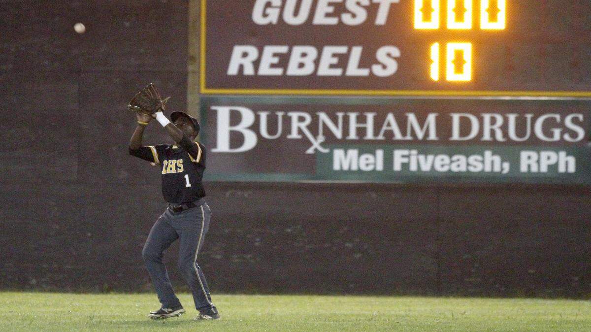 TIM ISBELL/SUN HERALD 
 D'Iberville's Travis Bender catches a fly ball to deep center against George County, Friday, Apr. 15, 2016.