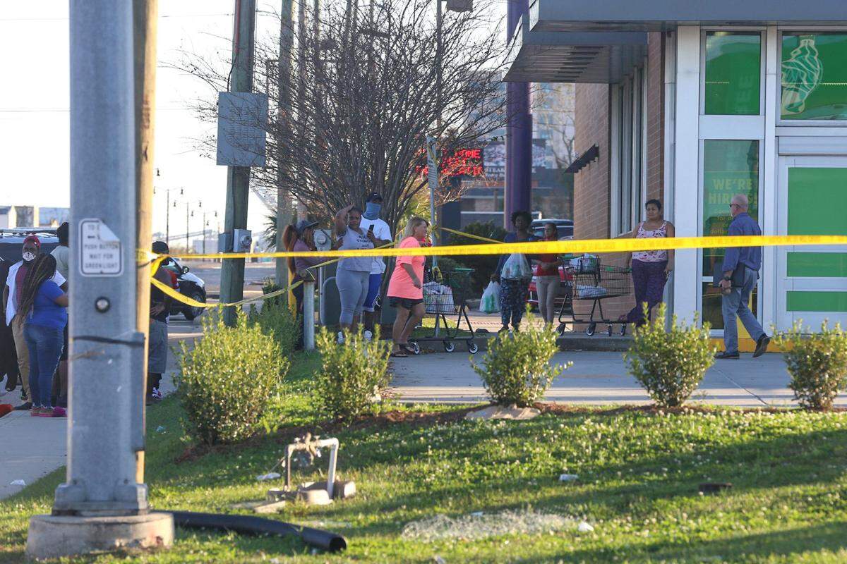 A crowd gathered outside the Dollar Tree where Gulfport police shot a man around 3 p.m. on Thursday, Nov. 12. The Gulfport Police Department said the man was transported to the hospital but offered no details on his condition.