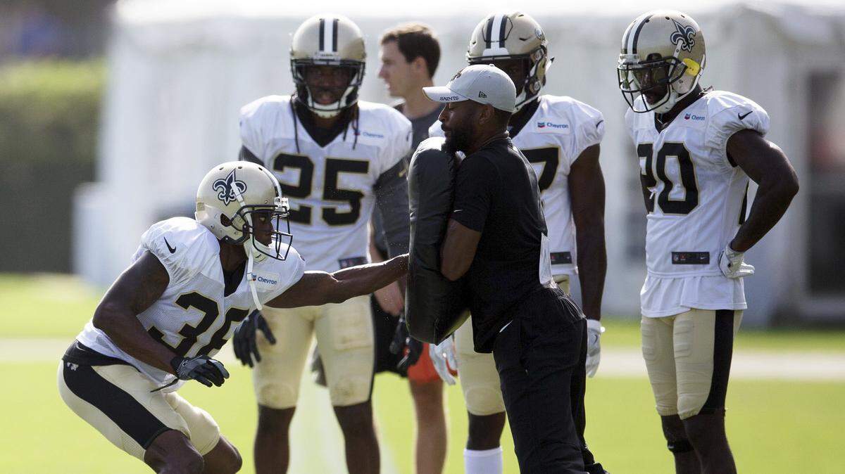 New Orleans Saints’ Robert Nelson (36) and Marcus Williams (25) partake in a drill in Metairie, La., on Sunday.