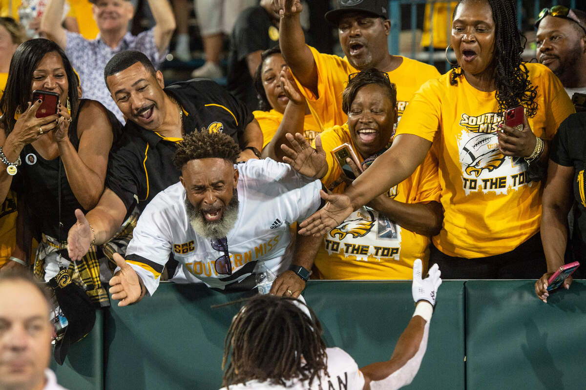 Southern Miss fans celebrate the players after USM beat Tulane at Yulman Stadium in New Orleans on Saturday, Sept. 24, 2022.