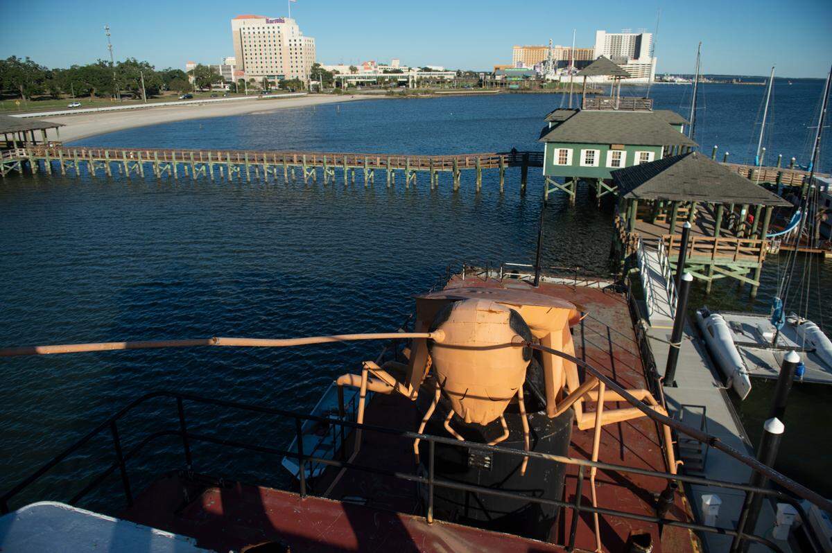 A giant steel cockroach sits on top of an old tugboat turned artificial reef in Biloxi on Thursday, Nov. 21, 2024.