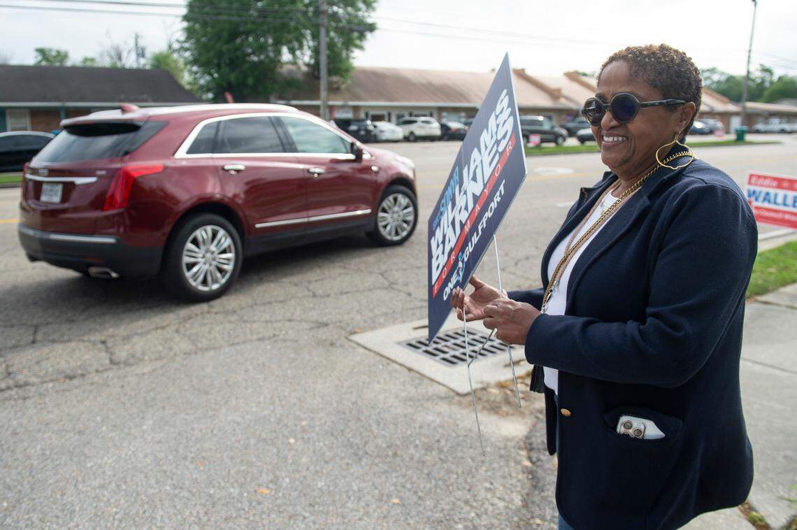 Sonya Williams Barns, who is running for Gulfport mayor, campaigns outside a polling place at Orange Grove Community Center in Gulfport on Tuesday, April 1, 2025.