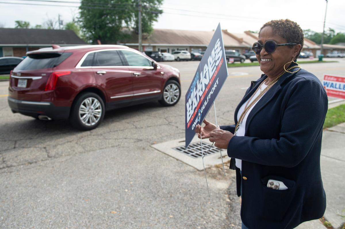 Sonya Williams Barnes, the Democratic candidate for Gulfport mayor, campaigns outside a polling place at the Orange Grove Community Center in Gulfport during party primaries on Tuesday, April 1, 2025.