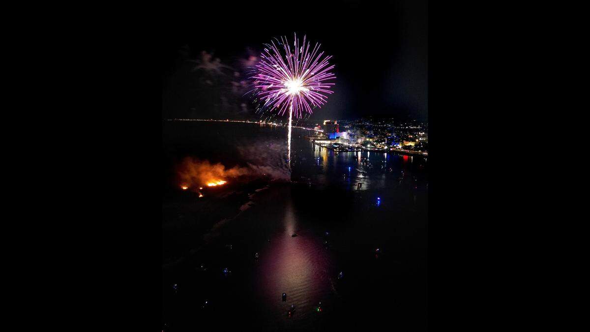 A brush fire burned on Deer Island during a fireworks show on July 4, 2025.