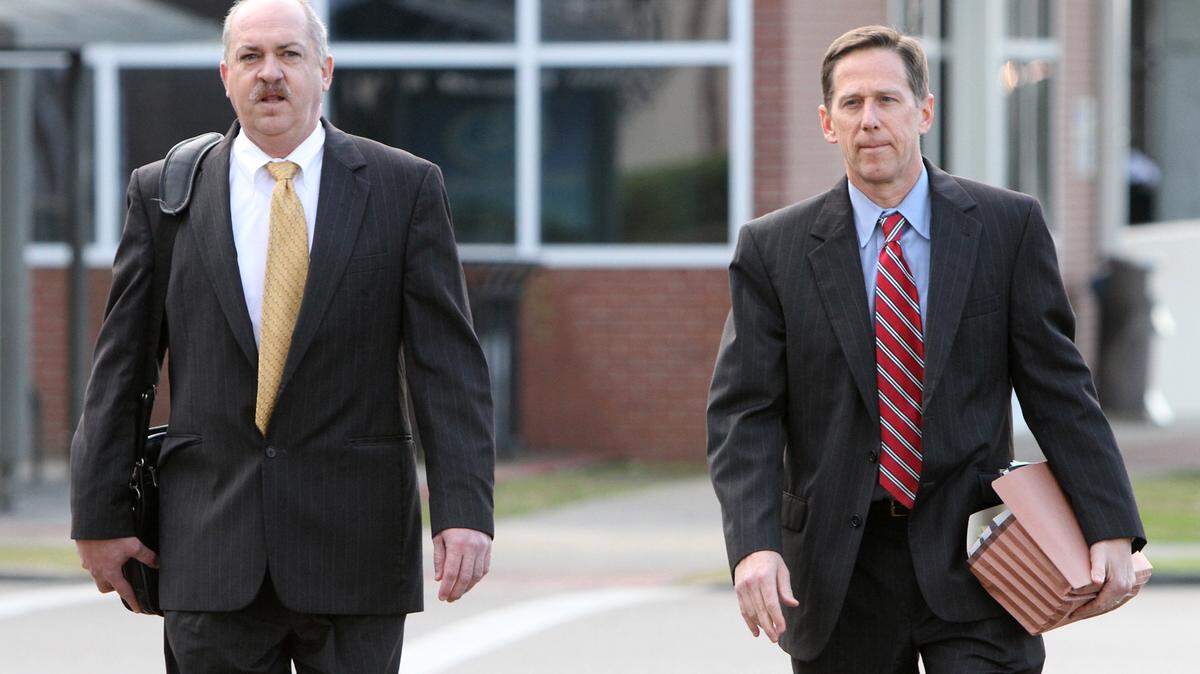 JOHN FITZHUGH/SUN HERALD 
 Singing River Hospital Systems attorneys Brett Williams, left, and Kelly Sessoms arrive at the federal courthouse in Gulfport on Wednesday Jan. 20, 2015 for a hearing on the Singing River Hospital Systems pension plan settlement.