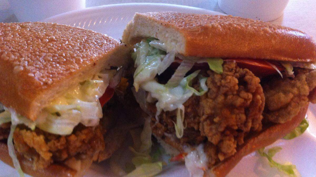 TAMMY SMITH/SUN HERALDA pressed and dressed oyster half po-boy is served at Herrin's Short Stop in Saucier.