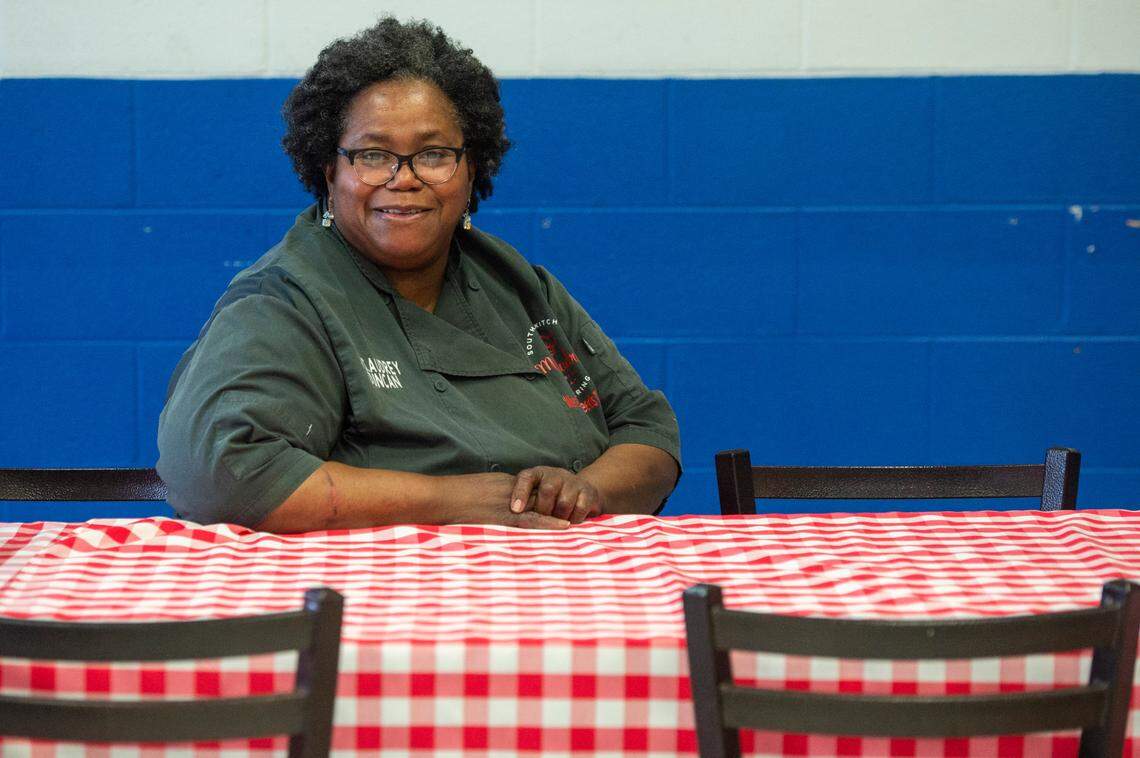 Audrey Duncan, the namesake and owner of Ms. Audrey’s Southern Kitchen and Catering, at a table inside her restaurant in Gaston Point on Tuesday, Dec. 21, 2021.