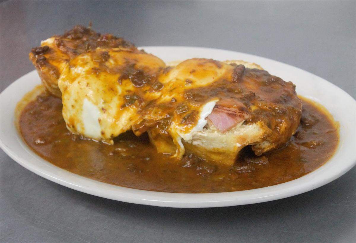 One of the bestsellers at Fill-Up with Billups in downtown Biloxi is the HangoverPart II. It’s a split biscuit topped with Creole cream cheese, seared ham, two eggs and house made crawfish etouffee.